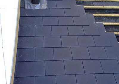 Re-pointing ridge mortar on Dublin roof by Affordable Roofers.